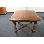 An oak early 20th century pull out dining table