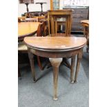 A Victorian D-shaped turnover top table on club feet