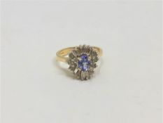 A diamond and tanzanite cluster ring set in 14ct yellow gold.