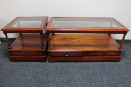 A mahogany glass top coffee table and matching lamp table