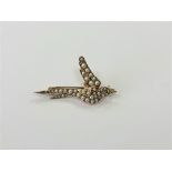 A 15ct gold pearl set swallow brooch