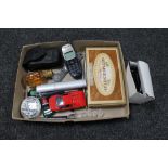 A collection of match cases, die cast cars, mobile telephone, pens,