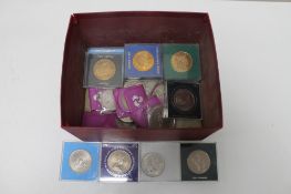 A box of commemorative crowns and bronze coins