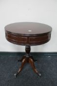 An inlaid mahogany pedestal drum table together with a wine table