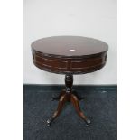 An inlaid mahogany pedestal drum table together with a wine table