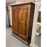 A rustic French double door cabinet fitted with two drawers,