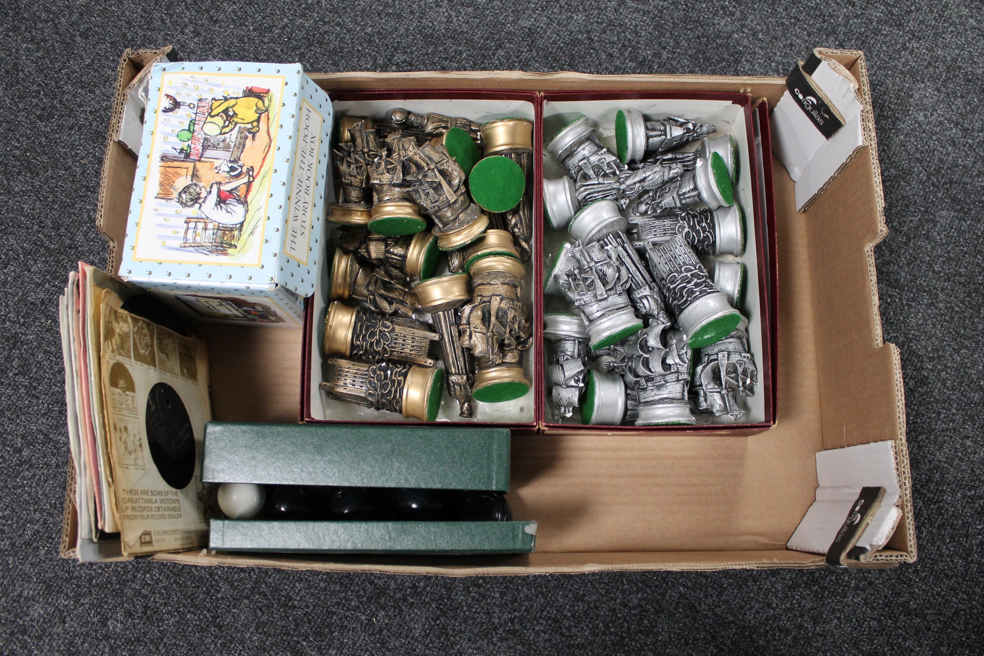 A box of mini carpet bowls, Whinnie the Pooh box set, chess pieces,