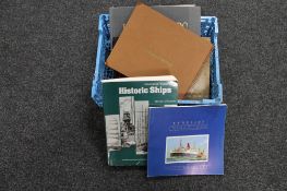 A basket of two albums of monochrome photographs relating to ships,