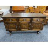 A Siesta Chapmans oak triple door sideboard fitted with three drawers