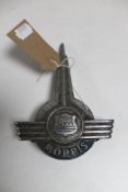 A vintage Morris truck badge