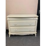 A Laura Ashley two drawer chest with slide,