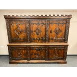 A good quality carved oak sideboard, with castellated frieze,