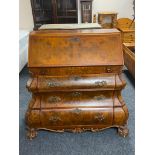 A reproduction walnut effect Dutch style bombe bureau