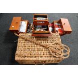 A wicker picnic basket together with a carpet beater and sewing box with accessories
