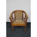 A pine framed bergere tub chair