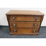 An antique pitch pine three drawer dressing chest (lacking mirror back)