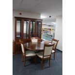 A contemporary G-plan seven piece dining room suite comprising of four drawer cabinet,
