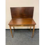 A George III inlaid mahogany tea table,