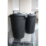 Three black plastic storage bins with lids