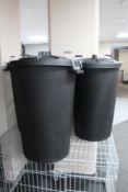 Three black plastic storage bins with lids