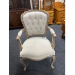 A French style salon armchair in beige button fabric