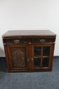 An Edwardian mahogany double door cabinet fitted two drawers