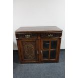 An Edwardian mahogany double door cabinet fitted two drawers