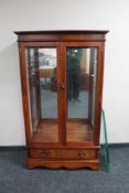 A Regency style glazed display cabinet