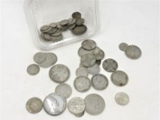 A collection of silver six pence pieces, American Dime, half dollar, quarter dollar,