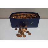 A box of mid 20th century un-circulated pennies and half pennies