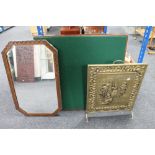 An Edwardian oak framed mirror together with a brass fire screen and a folding card table