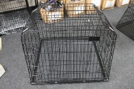 A folding metal dog cage width 94 cm with divider