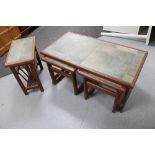 A mid century teak tiled coffee table fitted with two beneath and matching magazine rack,