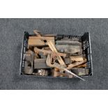 A plastic crate of vintage wood working tools, wood planes, hand saw, vices,