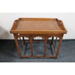 A folding Eastern table with brass inlaid and lift off gallery tray