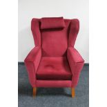 A mid 20th century wingback armchair