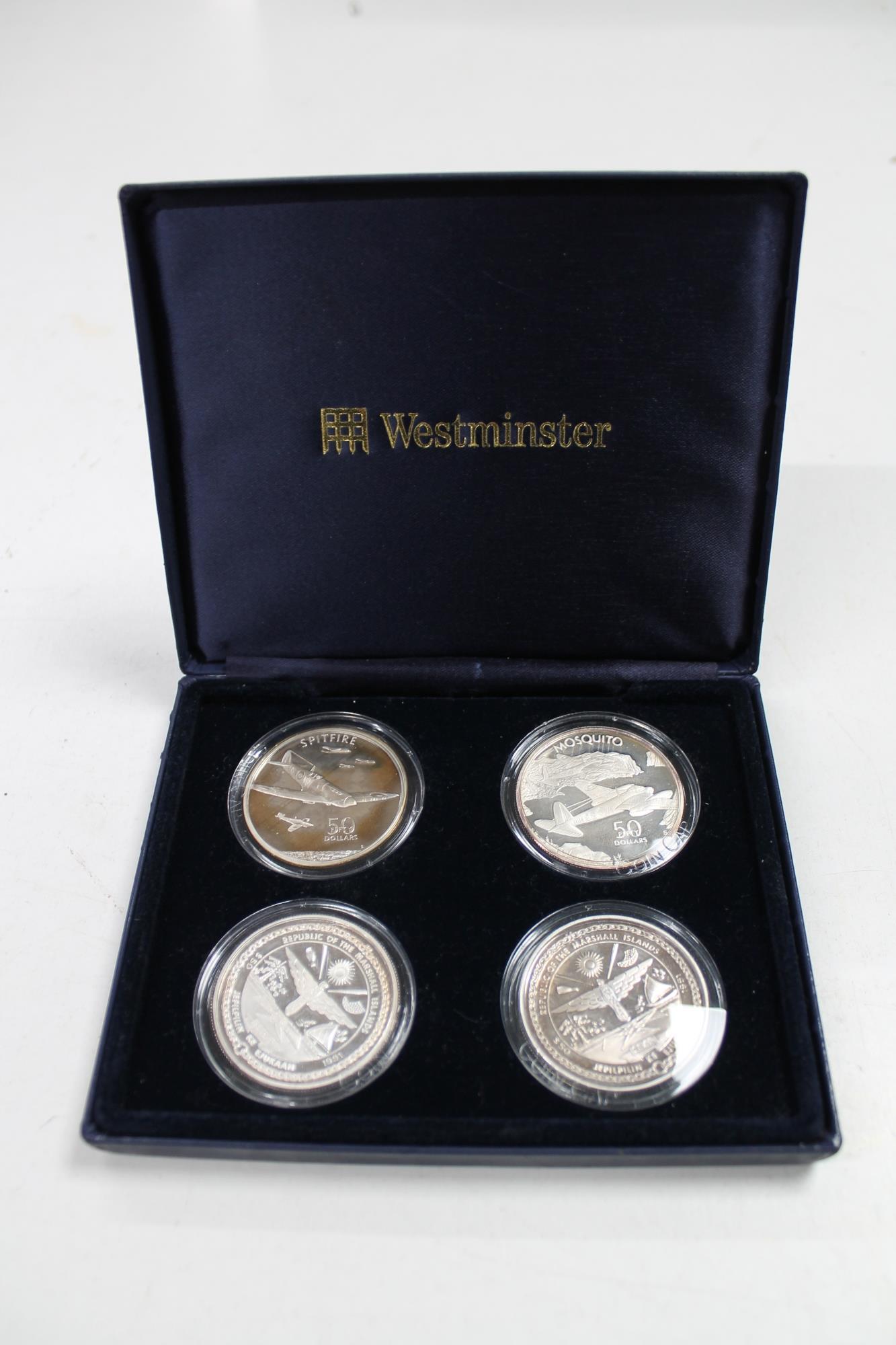 Four Sterling silver Westminster coin collection '50 dollar' commemorative aircraft coins, cased.