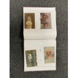 An album of antique and later postcards - dogs