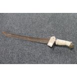 A 19th century and later short sword with lion head pommel