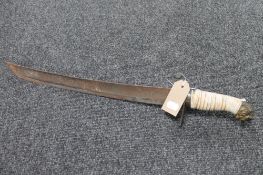 A 19th century and later short sword with lion head pommel