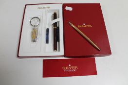 A boxed Shaeffer pen set with 14ct gold nib together with a further Cross pen