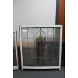 A large framed stained glass leaded window