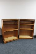 A pair of inlaid yew wood open bookshelves