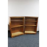 A pair of inlaid yew wood open bookshelves