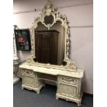 A classical style gilded cream mirrored dressing table,