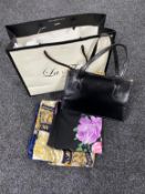 A box of vintage scarves and leather handbag