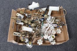 A box of metal light fittings together with a fringed woollen rug