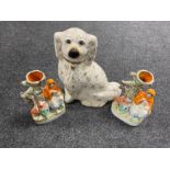 A pair of Staffordshire flat backed spill vases together with a Staffordshire spaniel with glass