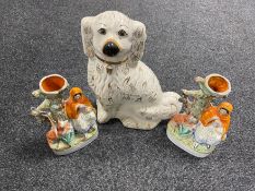 A pair of Staffordshire flat backed spill vases together with a Staffordshire spaniel with glass