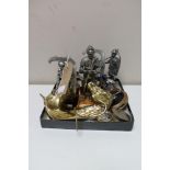 A box of two brass horse head coat hooks, pill boxes, three Royal Hampshire metal figures,
